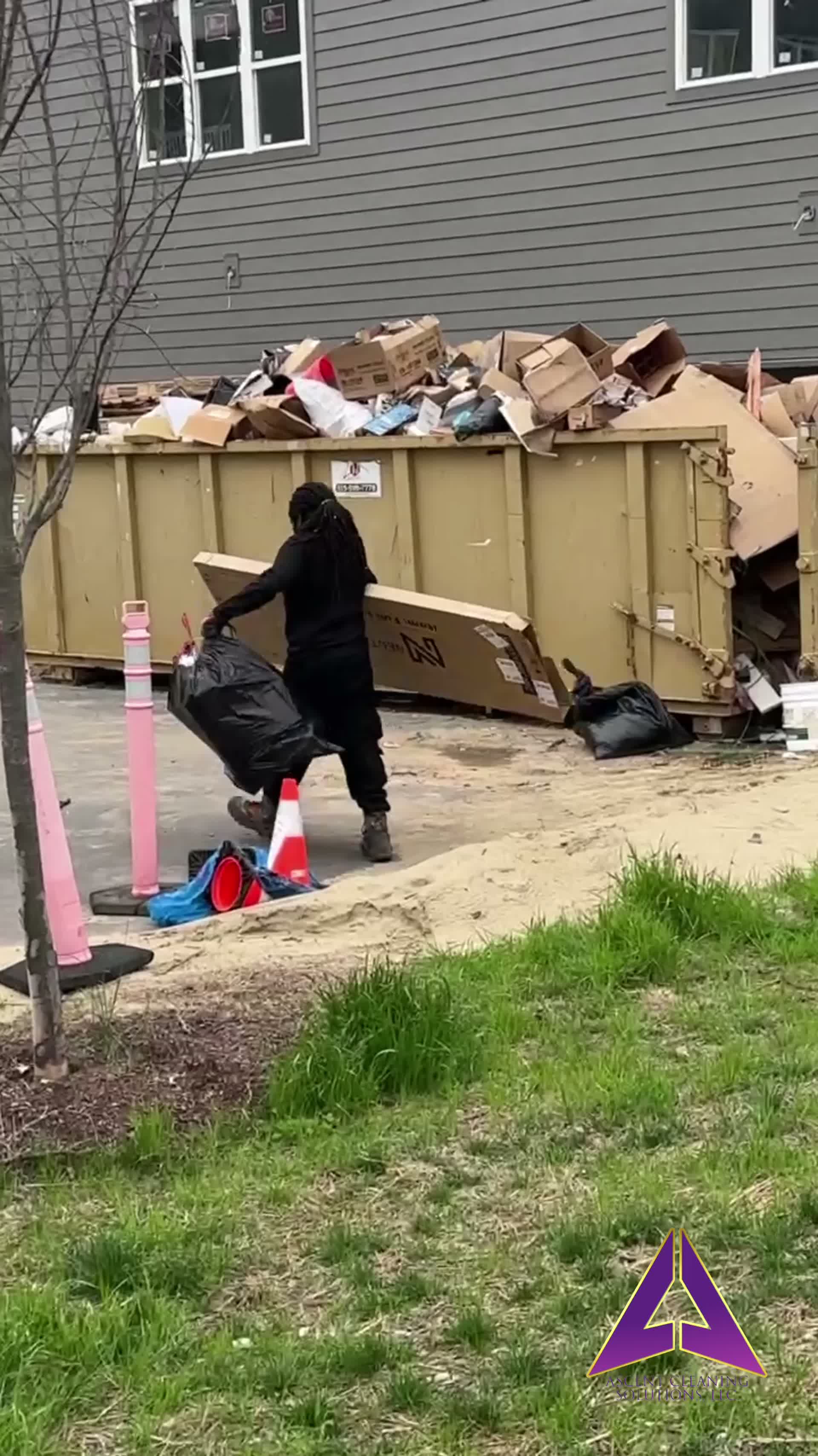 Aquamen Cleaning team member loading construction debris on a Memphis job site
